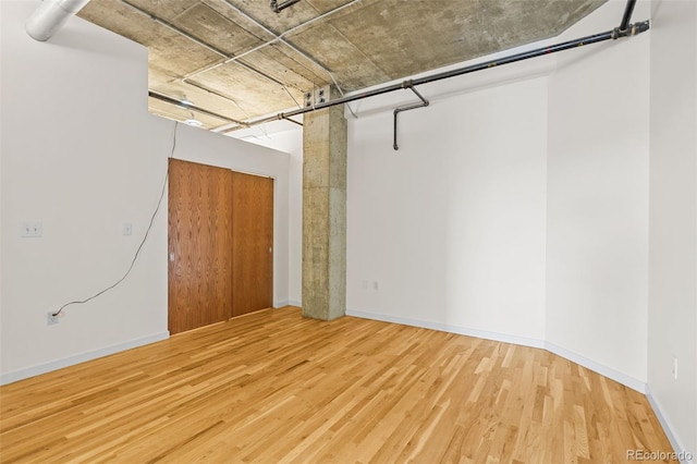2020 Arapahoe St Unit 970, Denver, CO 80205 - unfurnished room with wood finished floors and baseboards