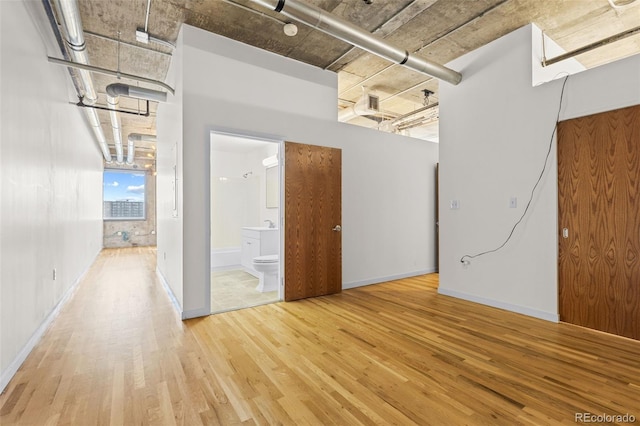 2020 Arapahoe St Unit 970, Denver, CO 80205 - unfurnished room with wood finished floors and baseboards