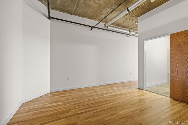 2020 Arapahoe St Unit 970, Denver, CO 80205 - below grade area with wood finished floors and baseboards