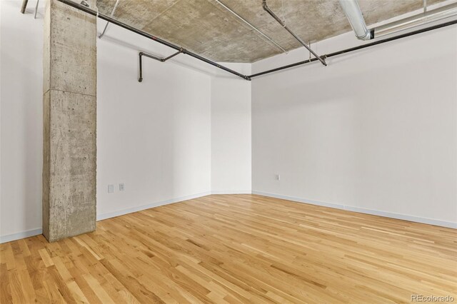 2020 Arapahoe St Unit 970, Denver, CO 80205 - unfurnished room with wood finished floors and baseboards
