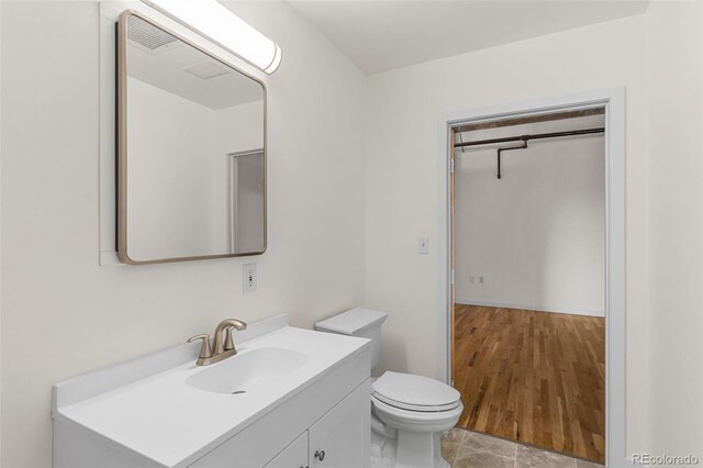 2020 Arapahoe St Unit 970, Denver, CO 80205 - half bathroom with vanity and toilet