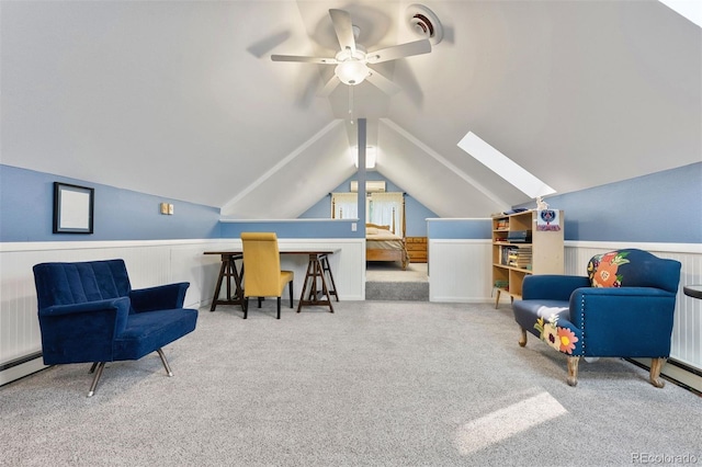 36 Lake Ave, Colorado Springs, CO 80906 - living area featuring ceiling fan, carpet flooring, wainscoting, a skylight, and vaulted ceiling