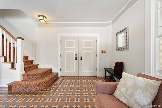 36 Lake Ave, Colorado Springs, CO 80906 - entryway with stairs, baseboards, and crown molding