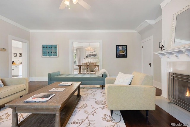 36 Lake Ave, Colorado Springs, CO 80906 - living area featuring a fireplace with flush hearth, ornamental molding, wood finished floors, a ceiling fan, and baseboards