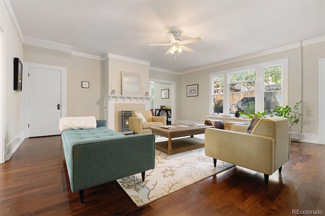 36 Lake Ave, Colorado Springs, CO 80906 - living room with ceiling fan, wood finished floors, a warm lit fireplace, baseboards, and crown molding