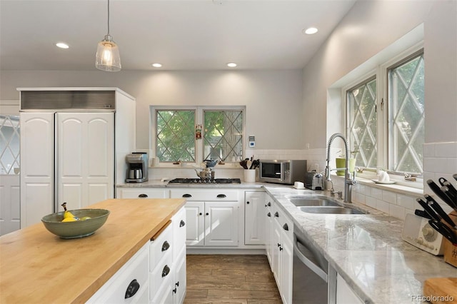 36 Lake Ave, Colorado Springs, CO 80906 - kitchen with a sink, stainless steel appliances, plenty of natural light, recessed lighting, and white cabinetry