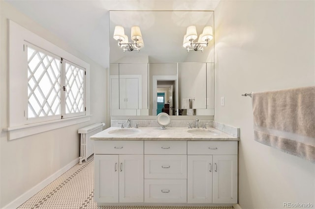 36 Lake Ave, Colorado Springs, CO 80906 - full bathroom with double vanity, baseboards, and radiator