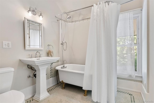 36 Lake Ave, Colorado Springs, CO 80906 - bathroom with toilet, tile patterned floors, and baseboards