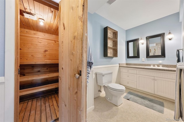 36 Lake Ave, Colorado Springs, CO 80906 - bathroom featuring a sauna / steam room, vanity, toilet, wainscoting, and wood walls