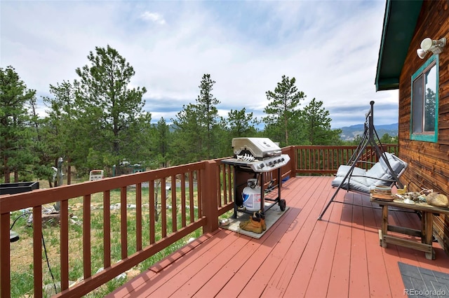 wooden terrace featuring area for grilling