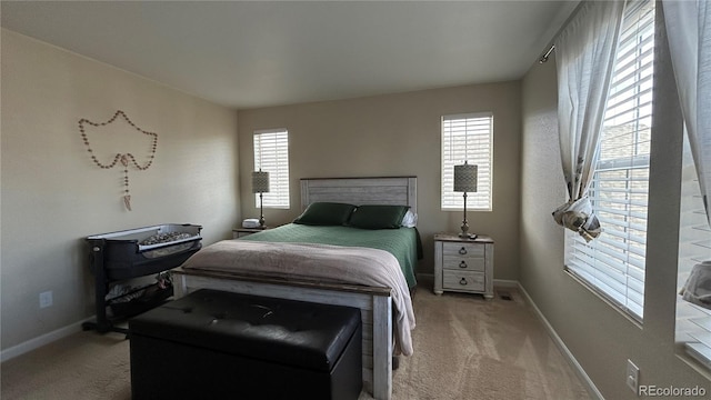 bedroom featuring light colored carpet