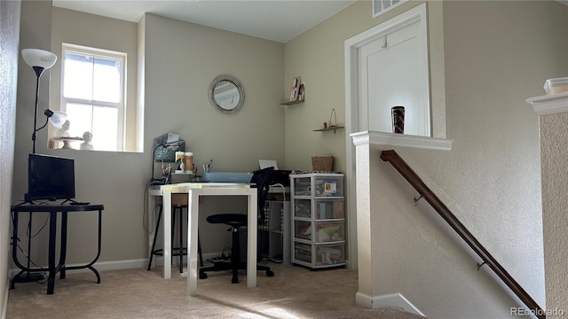 office area featuring light carpet