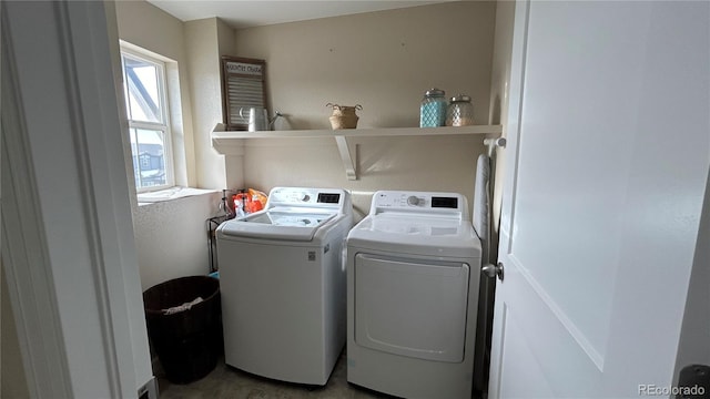 laundry room featuring washing machine and clothes dryer