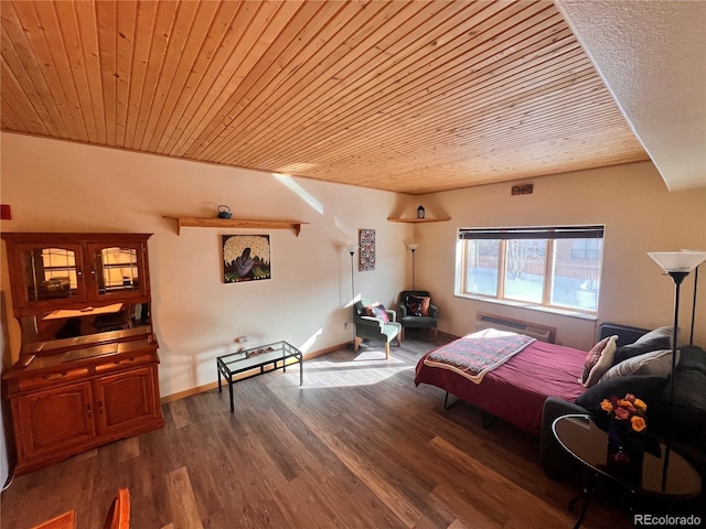 bedroom with dark hardwood / wood-style flooring and wood ceiling