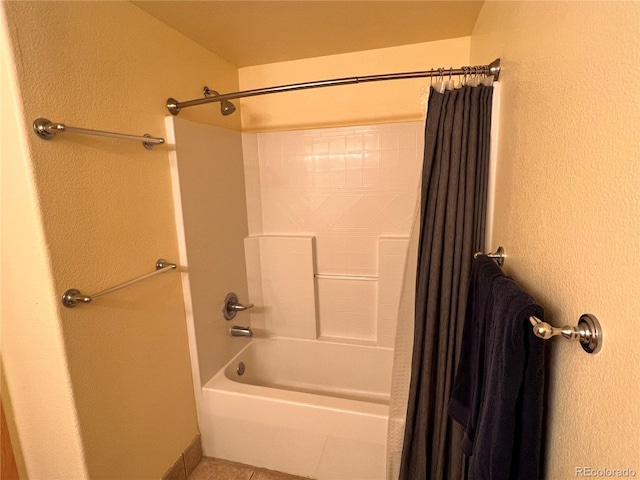 bathroom with tile patterned flooring and shower / tub combo with curtain