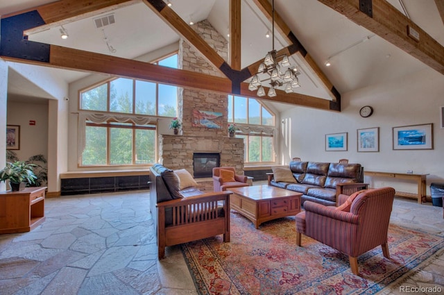 living room featuring high vaulted ceiling, beamed ceiling, and a stone fireplace