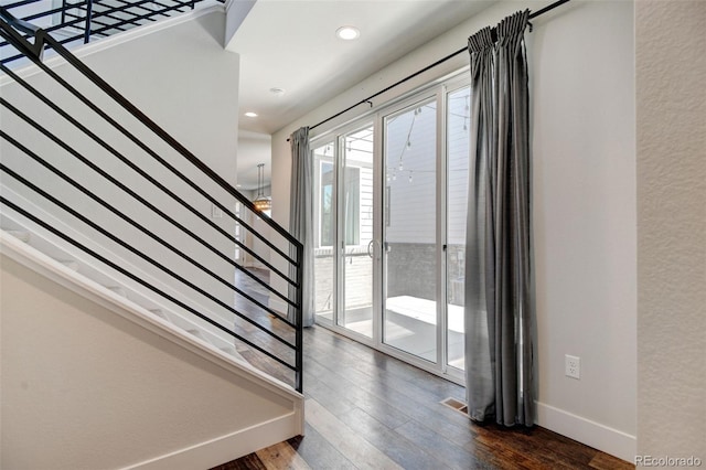 entryway with dark hardwood / wood-style floors