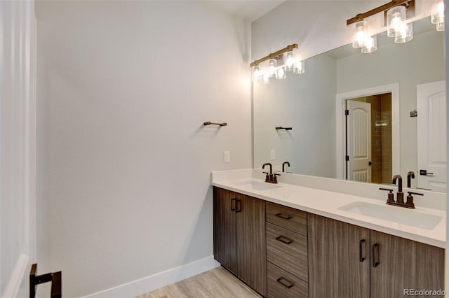 bathroom featuring vanity and hardwood / wood-style flooring