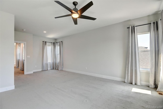 carpeted empty room with ceiling fan