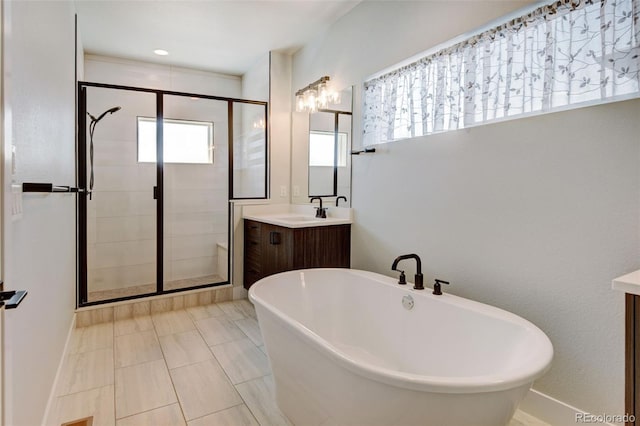 bathroom with shower with separate bathtub and vanity