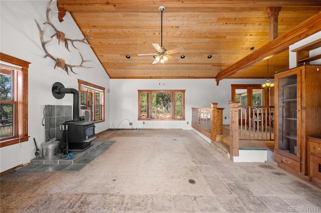 701/700 Bella Vista Ln, Cotopaxi, CO 81223 - unfurnished living room featuring wood ceiling, a wood stove, a ceiling fan, carpet floors, and high vaulted ceiling