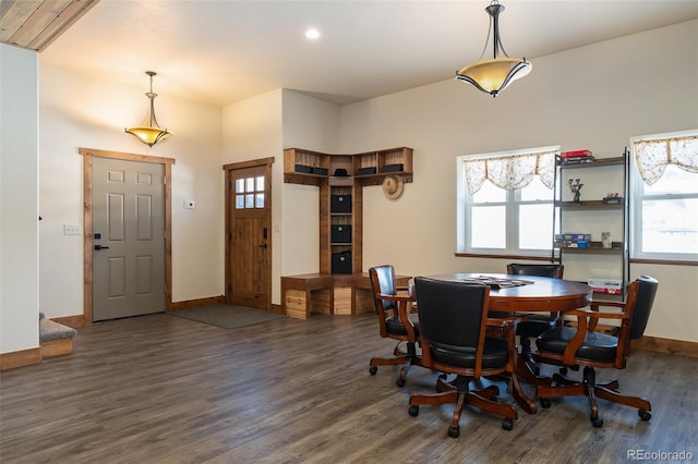 dining area with wood finished floors and baseboards