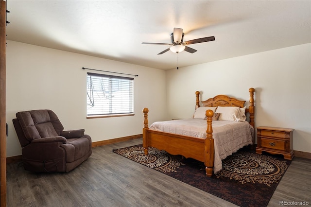 bedroom featuring ceiling fan, wood finished floors, and baseboards