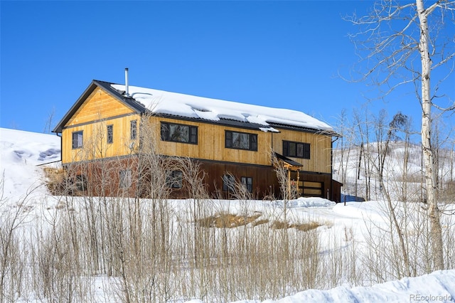 view of snow covered house