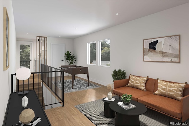 living room with a wealth of natural light, baseboards, light wood-style floors, and recessed lighting