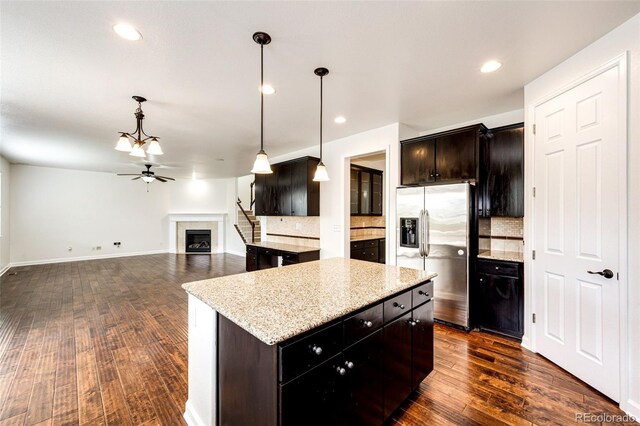 6528 S Kewaunee Way, Aurora, CO 80016 - kitchen featuring stainless steel fridge, decorative backsplash, ceiling fan, dark wood-style floors, and recessed lighting
