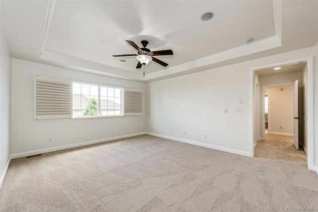 6528 S Kewaunee Way, Aurora, CO 80016 - unfurnished room with a tray ceiling, a ceiling fan, ornamental molding, light carpet, and a smoke detector