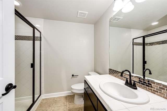 6528 S Kewaunee Way, Aurora, CO 80016 - full bath featuring vanity, a stall shower, and decorative backsplash