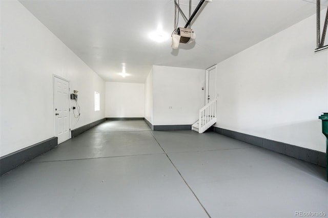 6528 S Kewaunee Way, Aurora, CO 80016 - garage with a garage door opener and baseboards