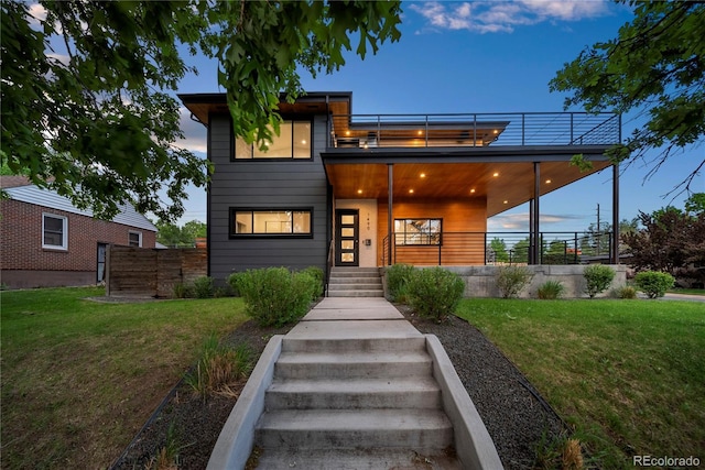 1490 S Vine St, Denver, CO 80210 - contemporary house featuring a front yard and a balcony
