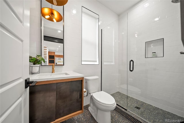1490 S Vine St, Denver, CO 80210 - bathroom featuring a stall shower, toilet, tile patterned flooring, and vanity