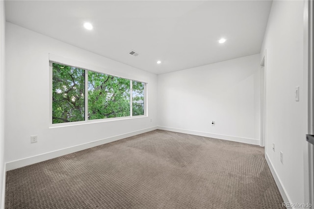 1490 S Vine St, Denver, CO 80210 - carpeted spare room with baseboards and recessed lighting