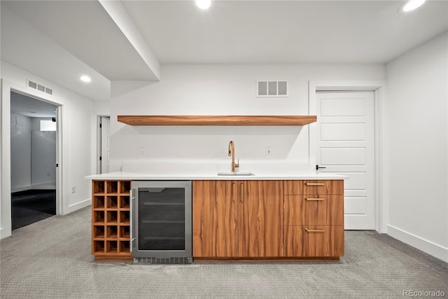 1490 S Vine St, Denver, CO 80210 - indoor wet bar featuring beverage cooler, recessed lighting, light carpet, and baseboards