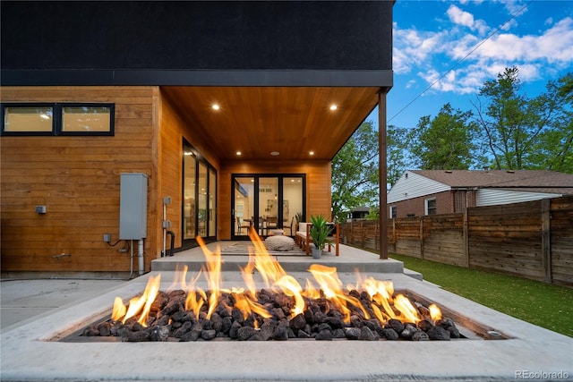 1490 S Vine St, Denver, CO 80210 - view of patio / terrace with an outdoor fire pit and fence