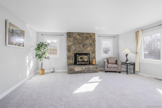 living area featuring carpet floors and baseboards