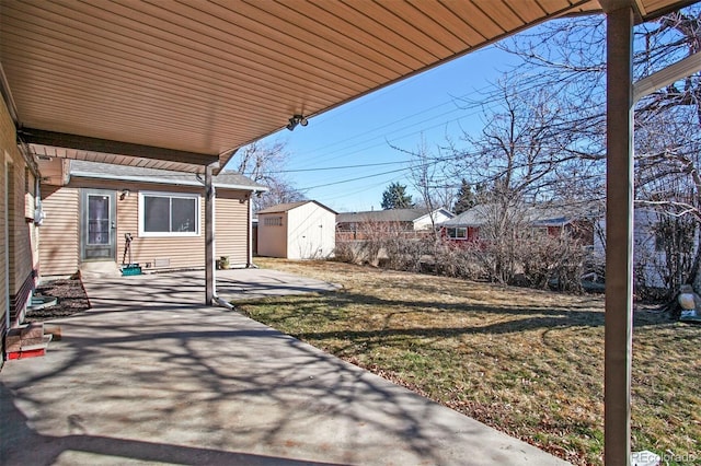 view of patio / terrace with an outbuilding and a storage unit