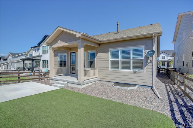 rear view of house with a patio