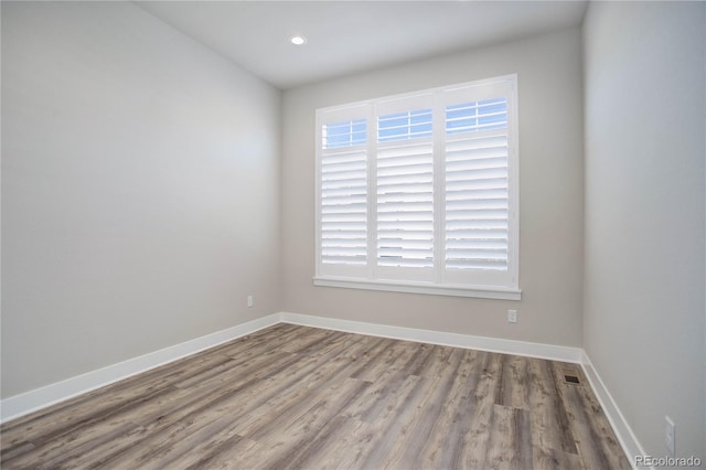 empty room featuring hardwood / wood-style floors