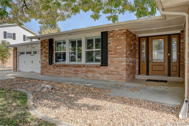 property entrance with a garage