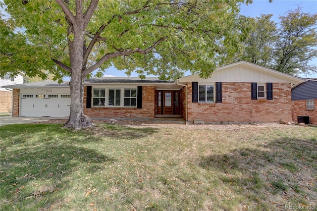 single story home featuring a garage, a front yard, and central AC