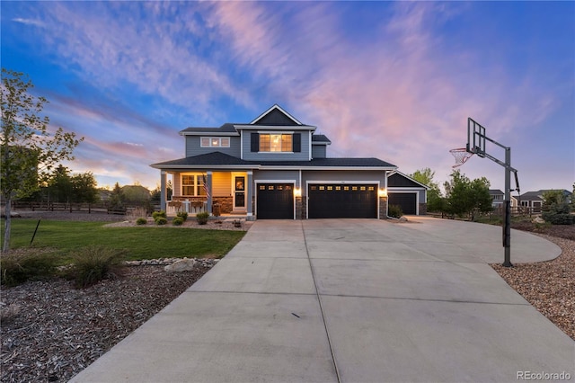 5181 Appleton Way, Castle Rock, CO 80104 - view of front of home with a porch, driveway, a garage, and stone siding
