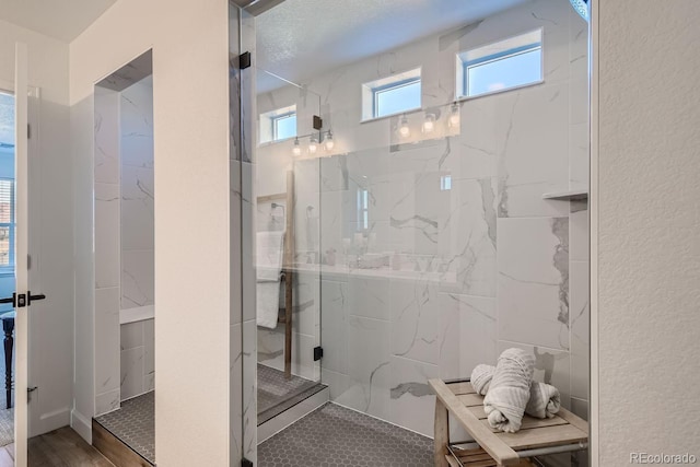 bathroom featuring tiled shower