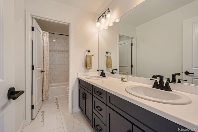 full bathroom with shower / tub combo with curtain, vanity, and toilet