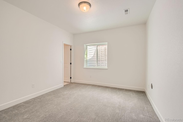 unfurnished room with carpet floors