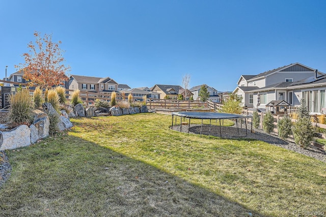 view of yard featuring a trampoline