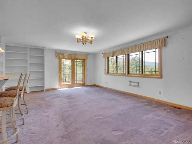 5336 High Rd, Evergreen, CO 80439 - unfurnished living room with a chandelier and carpet floors